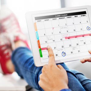 Image of a person with a tablet with a planner app