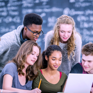 Students discussing over a laptop