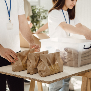 Photo of people with bags of food volunteering